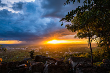 Storm cloud approaching at sunset