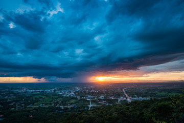 Storm cloud approaching at sunset