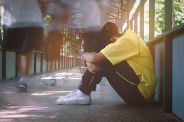 Depression student sitting on the bridge.