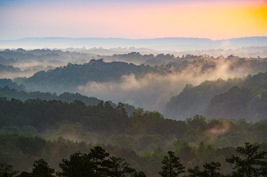 View from an overlook of rolling hills at sunrise near Cheaha Mountain in Alabama, USA