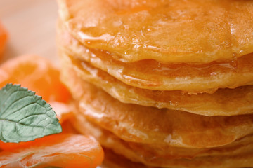 Naklejka na ściany i meble Delicious pancakes with honey, close up
