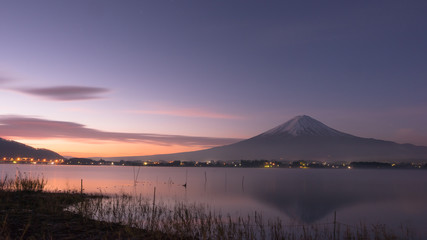 night scape before sunrise from mountain fuji at kawaguchiko lake japan with soft focus foreground