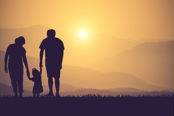 silhouette of a happy family and happy time sunset