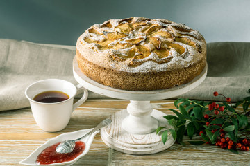 Apple pie and desserts on the table. Tea party in a rustic style. Sweet autumn still life