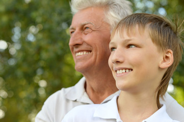 grandfather and grandson  in park 