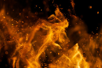 Flame of fire with sparks on a black background