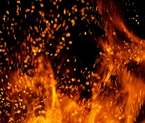 Crédence de cuisine en verre imprimé Flamme Flame of fire with sparks on a black background