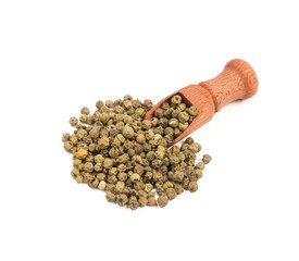 Wooden shovel with green pepper scattered from it
