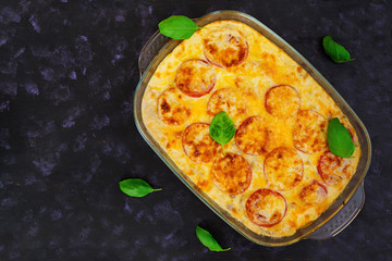 Eggplant casserole. Moussaka on dark background
