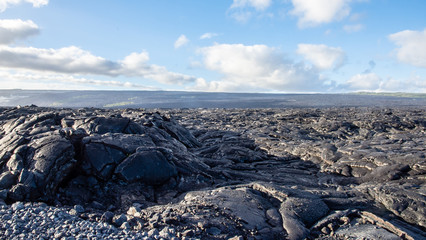 Clouds over lava field