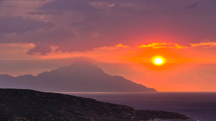 Stormy sky and sunrise at holy mountain Athos in Greece