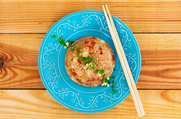 Tyahan with chicken and vegetables on wooden background