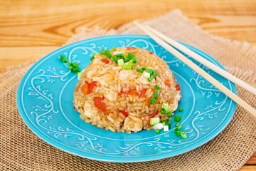 Tyahan with chicken and vegetables on wooden background