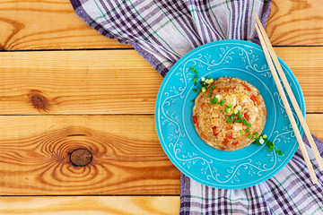 Tyahan with chicken and vegetables on wooden background