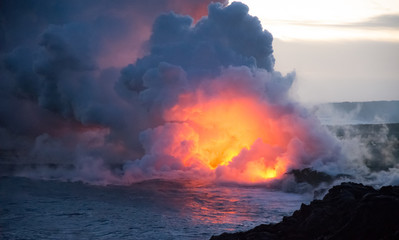Fototapeta na wymiar Lava flowing into ocean explosion eruption