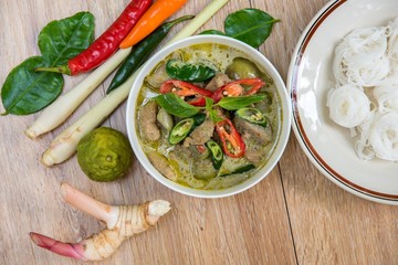 Thai chicken green curry with old wooden background, thai food