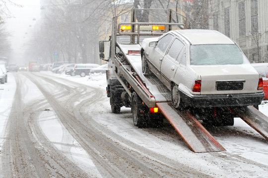 Towing car at winter snow