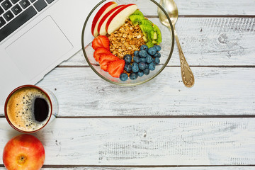 Breakfast break during the work with laptop
