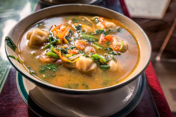 Traditional tibetian food is momo soup with vegetables  Darjeeling, India.