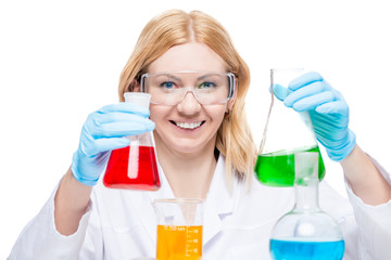 Fototapeta premium happy chemist in a laboratory with test tubes and flasks on a white background