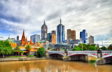 Fototapeta na wymiar Skyline of Melbourne along the Yarra River and Princes Bridge - Australia