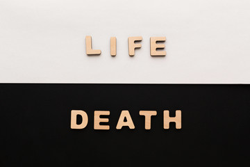 Word Life and Death on contrast background