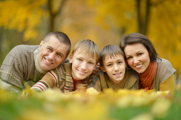 family in autumn forest