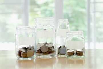 Glass jars with money coins ruble and empty sticker