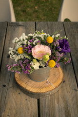 Beautiful bouquet of Autumn flowers arrangement in a wooden table - rustic style