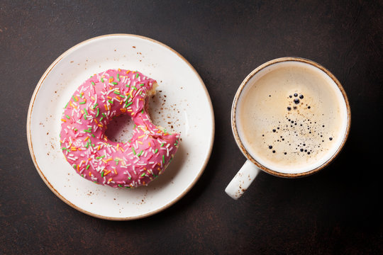 Coffee cup and donut