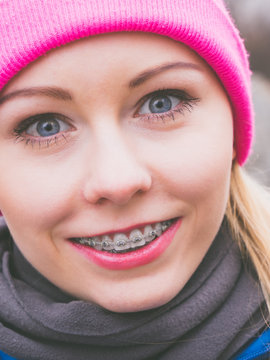 Smiling Woman Wearing Pink Beanie