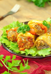 Baked peppers stuffed with meat, rice and vegetables