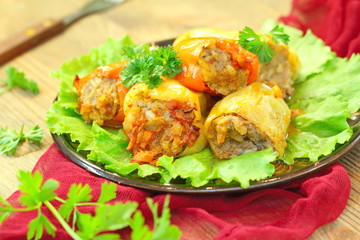 Baked peppers stuffed with meat, rice and vegetables