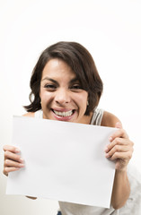 Fototapeta premium Beautiful young woman holding a blank sheet of paper