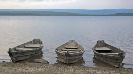 Fototapeta premium old fishing wooden boat on the lake