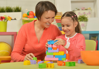 mother and daughter collecting blocks