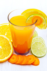 Glasses of ace  juice with carrot,orange and lemon