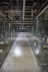 Fototapeta premium Long corridor in modern industrial production area 