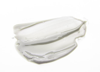 Smear cream isolated on white background. Cream texture.