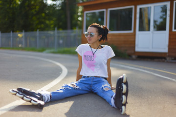 Summer girl in Park rollerblading