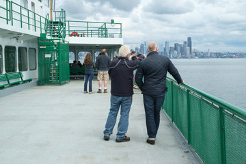 People on ferry boat approaching Seattle, Washington, USA