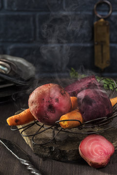 Rustic steamed beets and carrots on table