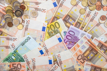 euro banknotes as background. 50 100 200 500