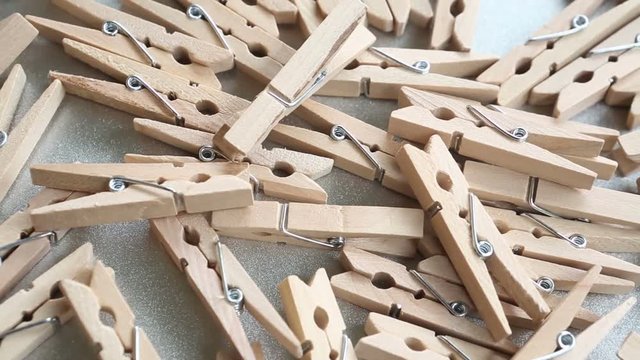 wooden clothespins on a rotating plate
