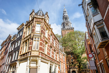 Obraz premium View on the beautiful old buildings in Amsterdam city during the sunny weather