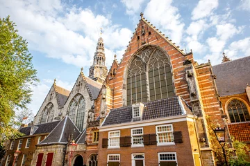Foto op Plexiglas Morning view on the Old church in Amsterdam city during the sunny weather © rh2010