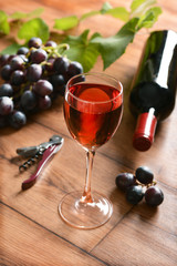 Glass of red wine - wood background