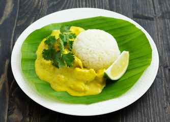 Yellow curry with chicken and rice. Asian cuisine.