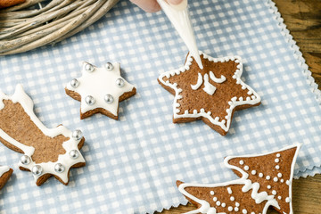 Decorating gingerbread cookies for christmas