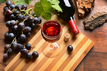 Glass of red wine - wood background